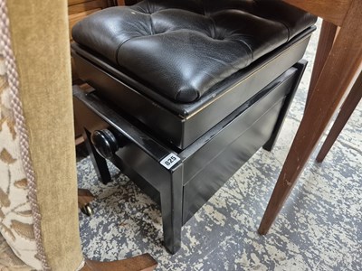 Lot 825 - An adjustable piano stool.