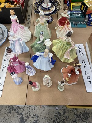 Lot 1613 - Fourteen porcelain figurines of ladies by...
