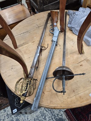 Lot 843 - A replica Winchester rifle and two decorative...