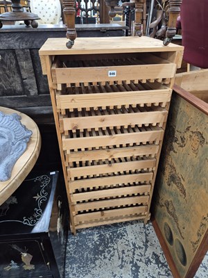 Lot 846 - A pine apple rack of 10 drawers.