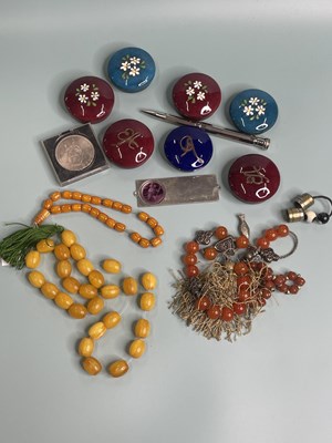Lot 389 - Four strands of various prayer beads, seven...