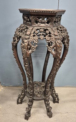 Lot 363 - A Chinese hardwood vase stand, the top inlaid...