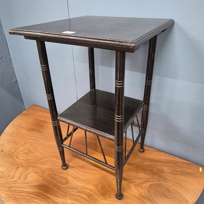 Lot 364 - An E W Godwin designed ebonised table, the rin...