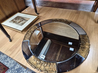 Lot 859 - A wall mirror and two prints.