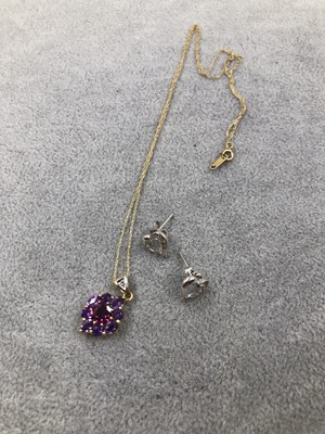 Lot 404 - A 10ct stamped stone set pendent and chain,...