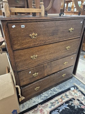 Lot 868 - A large oak two part chest of four deep drawers.