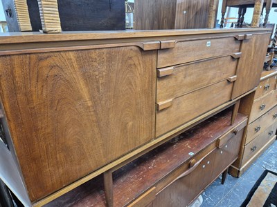 Lot 872 - A retro teak sideboard with three drawers...