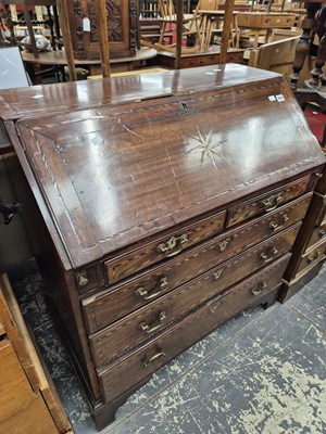 Lot 876 - A George III mahogany and inlaid bureau.