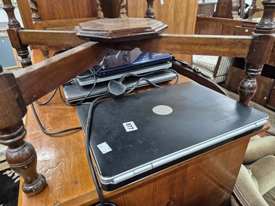 Lot 877 - Four vintage laptop computers.