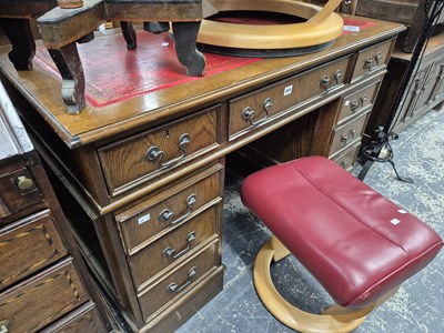 Lot 880 - An oak twin pedestal desk