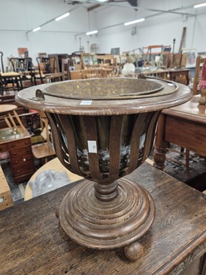 Lot 882 - An oak and brass lined planter Dutch form.
