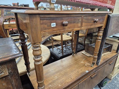 Lot 885 - A Victorian mahogany two drawer writing table.
