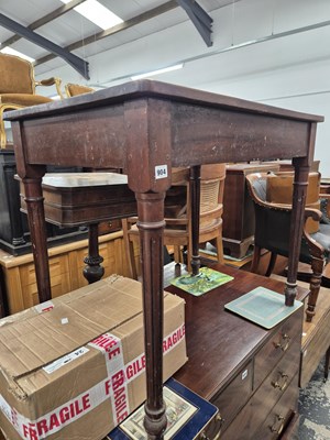 Lot 904 - A mahogany side table on turned fluted legs.W...
