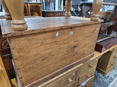 Lot 910 - An antique pine blanket box.