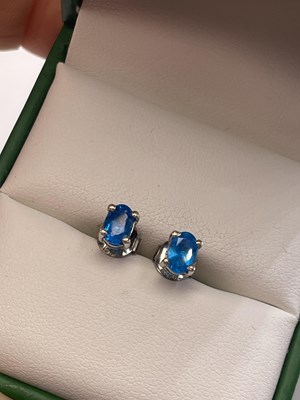 Lot 315 - A pair of neon blue apatite silver stud earrings.