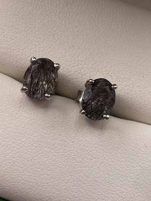 Lot 286 - A pair of silver rutile quartz studs