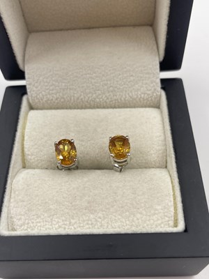 Lot 284 - A pair of silver and citrine stud earrings.