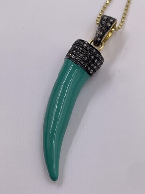 Lot 297 - A turquoise enamel tiger tooth style pendant...