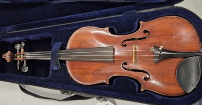 Lot 372 - A canvas-cased violin bearing the label for...
