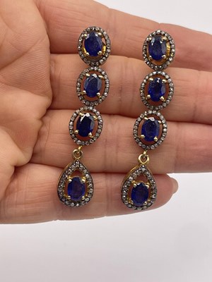 Lot 304 - A pair of silver gilt long drop earrings set...