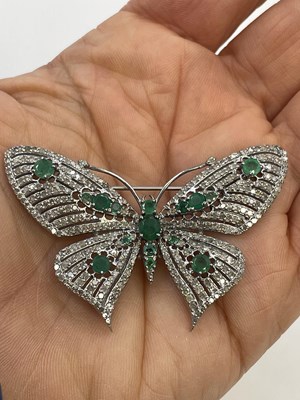 Lot 309 - A butterfly combined brooch/pendant, set with...