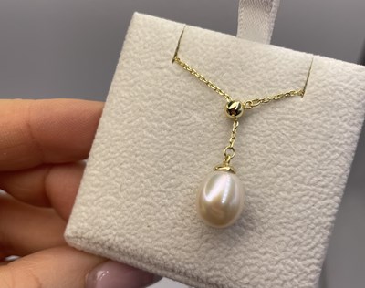 Lot 277 - A silver and gold-plated adjustable slider...