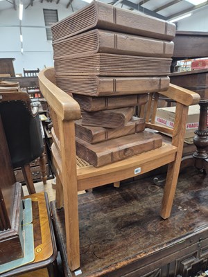 Lot 931 - A book form box stool and an armchair.