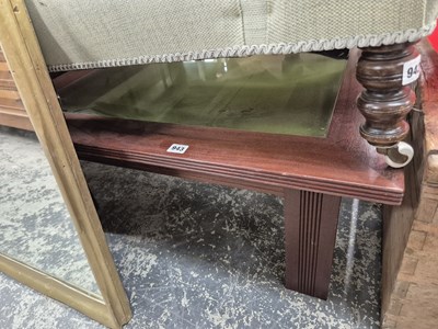 Lot 943 - A bijouterie glazed top coffee table.
