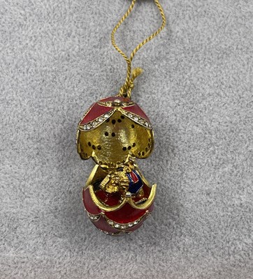 Lot 346 - A Majestic Collection enamelled egg hinged...