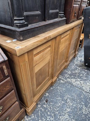 Lot 956 - A good quality solid hardwood three door side...