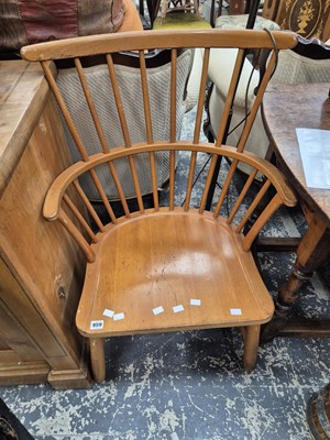 Lot 959 - An unusual American style stick back armchair.