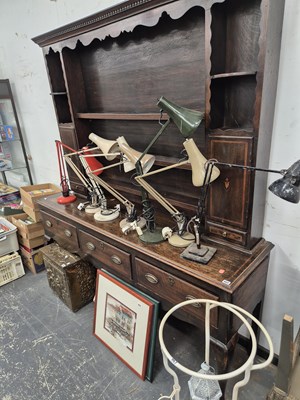 Lot 969 - A George III oak dresser with a plate rack...