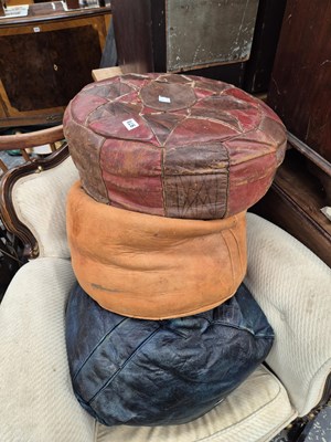 Lot 978 - Three leather poufes. Prov. Consigned from...
