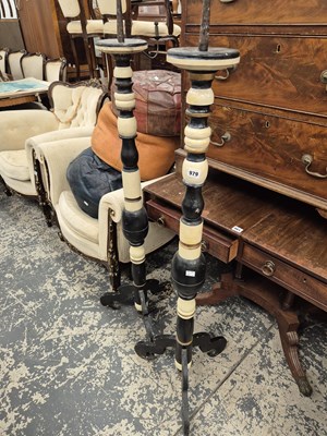 Lot 979 - A pair of pricket torchiere candlesticks. Prov....