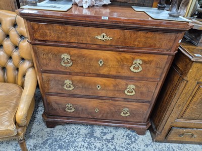 Lot 987 - A continental flame mahogany small four-drawer...