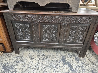 Lot 992 - An 18th-century carved panel front coffer.  H...