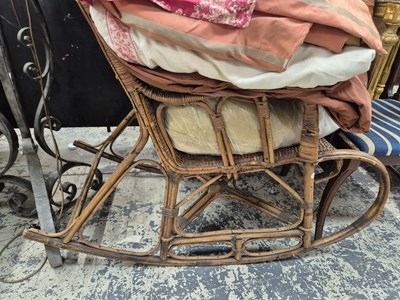 Lot 1001 - A rattan rocking chair.  Prov. Consigned from...