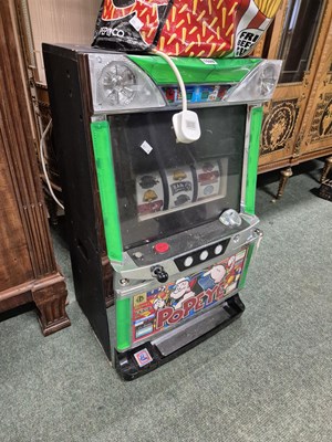 Lot 1028 - A "Popeye" slot machine with tokens.