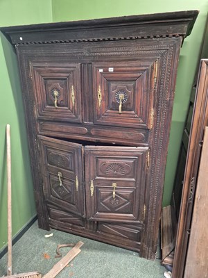 Lot 1044 - A french oak bretton four door cabinet. Prov....