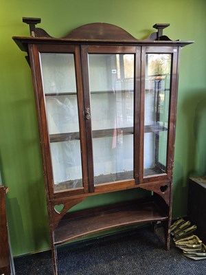 Lot 1051 - A mahogany display cabinet of Liberty style.