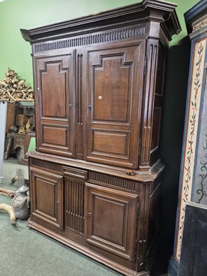 Lot 1055 - A substantial French oak four door cabinet...