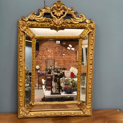 Lot 417 - A gilt framed mirror, the central rectangular...