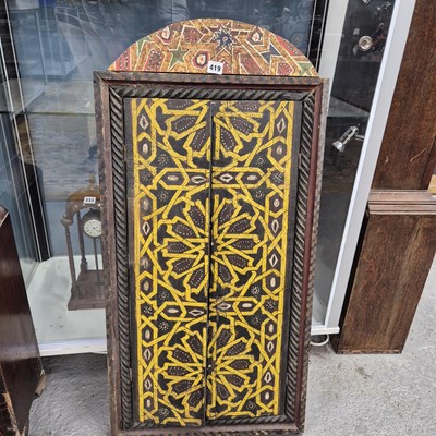 Lot 419 - An Islamic window shutter, the doors painted...