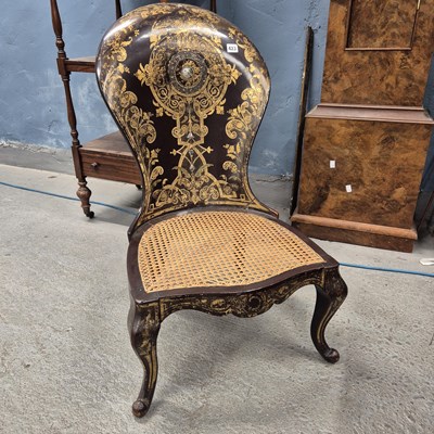 Lot 423 - A gilt and mother of pearl inlaid papier mache...