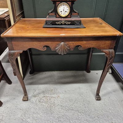 Lot 427 - A mahogany silver table, the dished...
