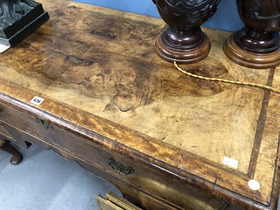 Lot 436 - A feather banded walnut chest with a long...