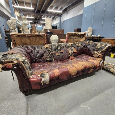 Lot 438 - A buttoned red leather upholstered chesterfield