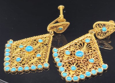 Lot 5 - A pair of antique Indian filigree and stone...