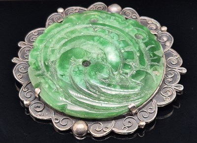 Lot 15 - A vintage carved green hardstone panel set...