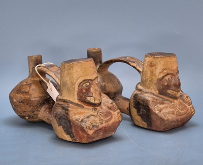 Lot 450 - Two similar precolumbian terracotta stirrup...